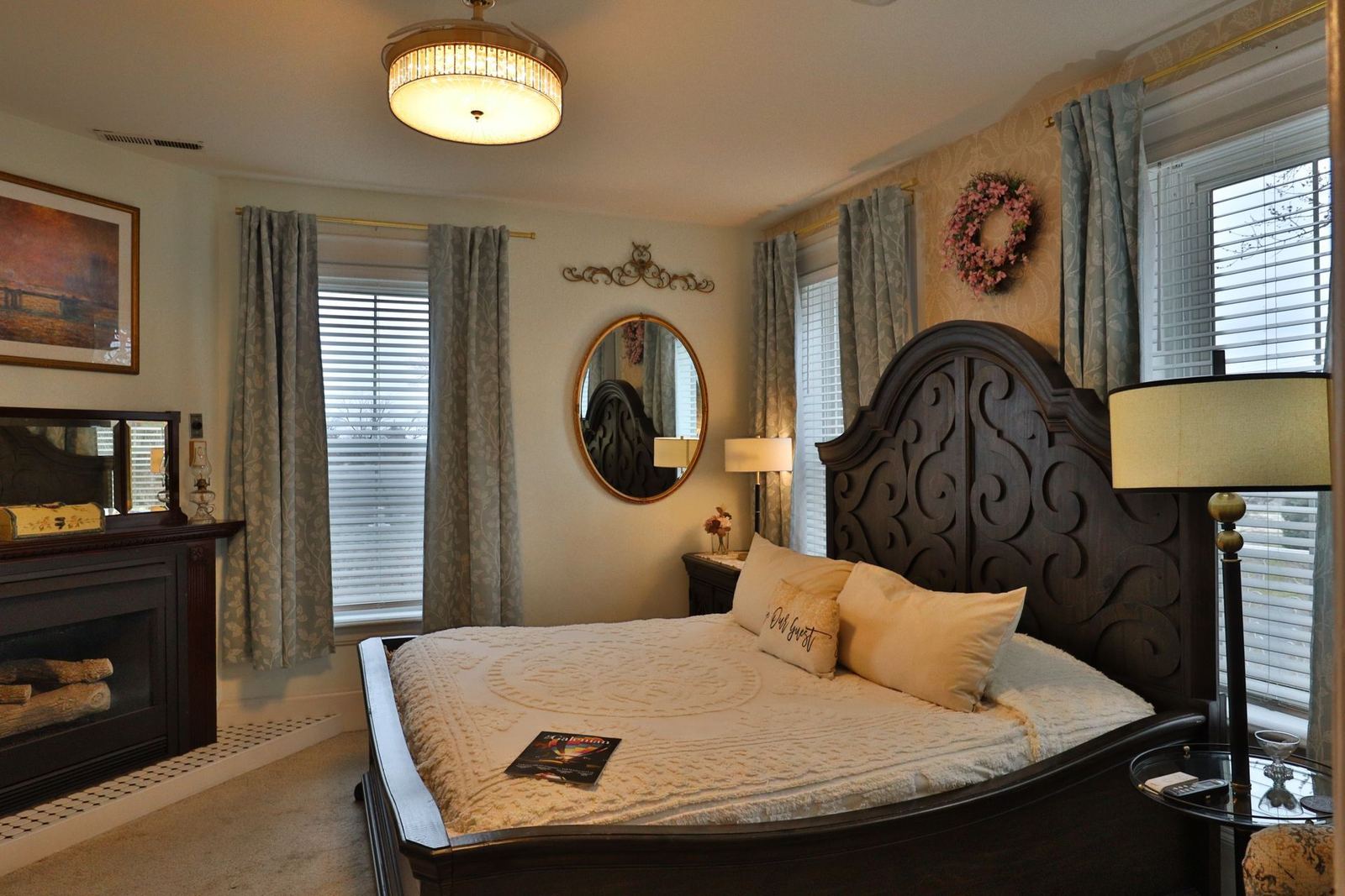 Alice's Room with queen bed, carved headboard and fireplace