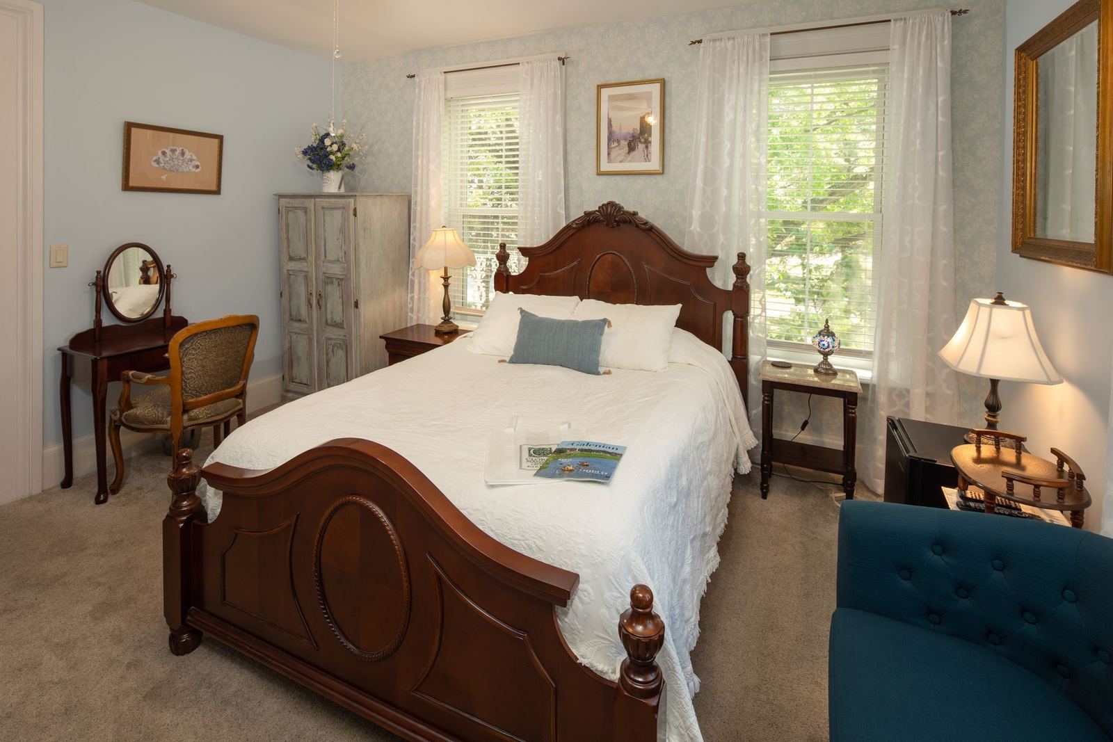 John's Room with dark wood bed and vanity